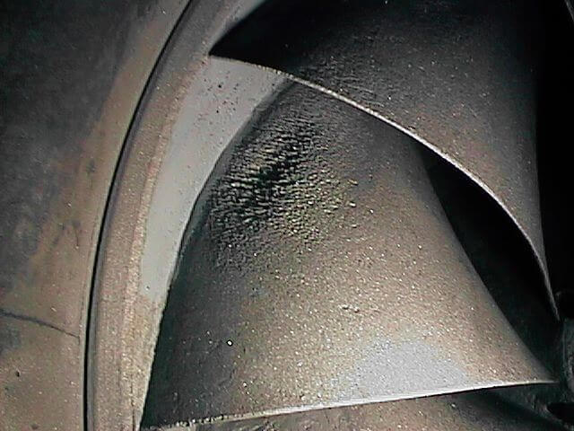 Figure 1. Francis turbine showing existing cavitation damage in LP area.